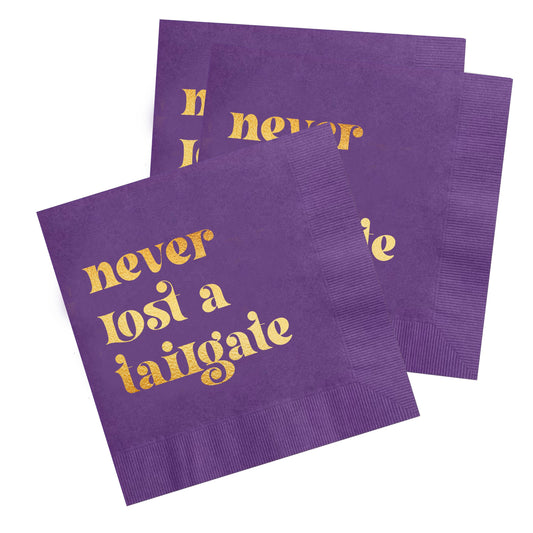 "Never Lost a Tailgate" gold foil + purple napkin pack